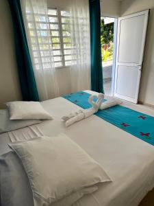 Hôtel DOUCE VAGUE客房内的一张或多张床位