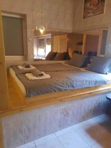 Posteľ alebo postele v izbe v ubytovaní CsillagVár apartman