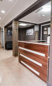 a lobby with a counter in a room at Hotel Resat in Izmir