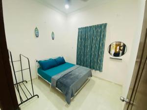 En eller flere senger på et rom på Homestay K Terengganu Affan04 dekat Unisza & Pantai