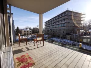 a balcony with a table and chairs and a building at Gemütliches Privatzimmer in geräumiger Gemeinschaftswohnung in Dresden