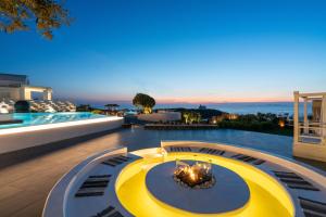 a luxury villa with a view of the ocean at Lovely House at Oia Village Center in Oia