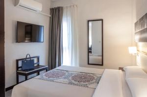 Postel nebo postele na pokoji v ubytování Hotel Macià Plaza