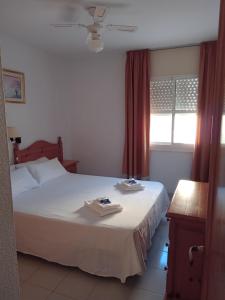 Кровать или кровати в номере Apartamentos Moguima