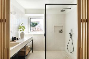 a bathroom with a shower and a sink at Villa Sofia Cascais in Cascais