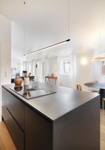 a kitchen with a sink and a counter top at Villa Sofia Cascais in Cascais