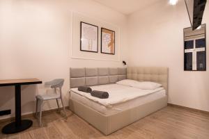 Łóżko lub łóżka w pokoju w obiekcie Dream Apartments - Gdańska 72