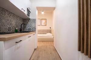 Łóżko lub łóżka w pokoju w obiekcie Dream Apartments - Gdańska 72