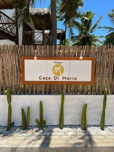 a sign for a casa de maria with cactuses at Casa di Maria flats in Icaraí