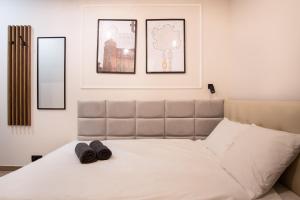 Łóżko lub łóżka w pokoju w obiekcie Dream Apartments - Gdańska 72