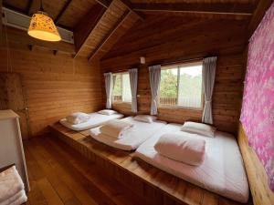 Ліжко або ліжка в номері Wen Qiao Villa