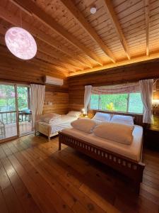 Ліжко або ліжка в номері Wen Qiao Villa