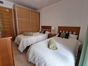 Łóżko lub łóżka w pokoju w obiekcie Apartamento Centro Fuengirola