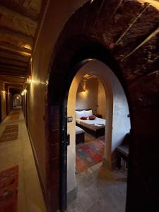Postel nebo postele na pokoji v ubytování Kasbah Ennakb