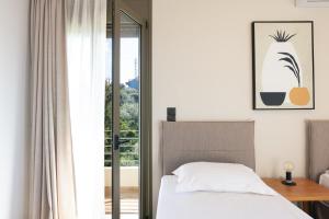 A bed or beds in a room at Villa Elia