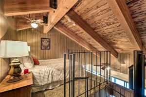 a bedroom with a bed and a wooden ceiling at Pinecrest Retreat with Fireplace! in Pinecrest