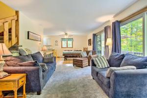 a living room with two couches and a table at Pet-Friendly Gilford Home 3 Mi to Gunstock and Lake in Gilford