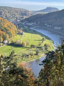 a view of a river from a hill with trees at Privathaus Wehle in Kurort Gohrisch