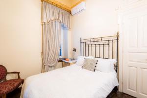 A bed or beds in a room at Archontiko Naoumidi