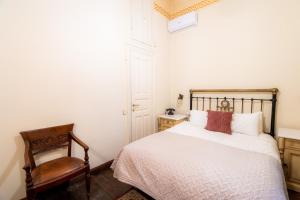 A bed or beds in a room at Archontiko Naoumidi