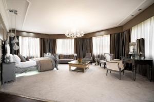 a bedroom with a bed and a living room at Derwent Manor Boutique Hotel in Consett +83 photos