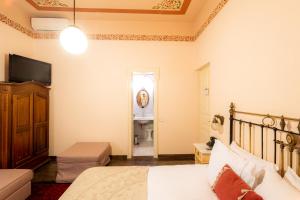 A bed or beds in a room at Archontiko Naoumidi