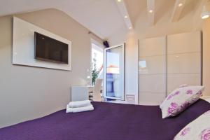 Postel nebo postele na pokoji v ubytování Laura Lux Suites