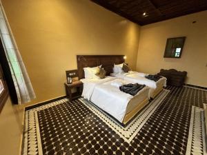 Postel nebo postele na pokoji v ubytování Hotel Riad Xaluca