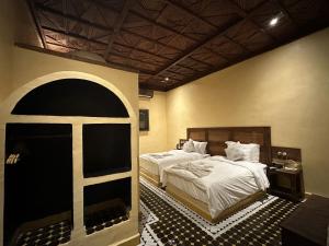 Postel nebo postele na pokoji v ubytování Hotel Riad Xaluca