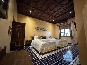 Postel nebo postele na pokoji v ubytování Hotel Riad Xaluca