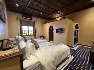 Postel nebo postele na pokoji v ubytování Hotel Riad Xaluca