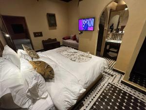 Postel nebo postele na pokoji v ubytování Hotel Riad Xaluca