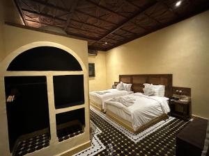 Postel nebo postele na pokoji v ubytování Hotel Riad Xaluca