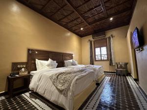 Postel nebo postele na pokoji v ubytování Hotel Riad Xaluca