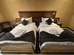 Postel nebo postele na pokoji v ubytování Hotel Riad Xaluca