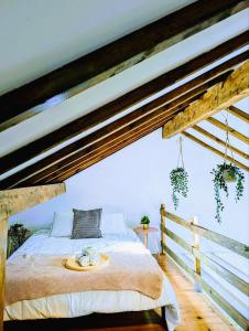 a bedroom with a bed with a tray on it at Cozy 3 BR Home - Close to Beach in Lourinhã