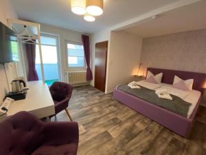 Postel nebo postele na pokoji v ubytování Hotel Rathaus