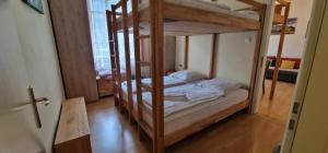 Postel nebo postele na pokoji v ubytování ciao-aschau Haus zur Burg Ap104 Pabst