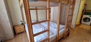 Postel nebo postele na pokoji v ubytování ciao-aschau Haus zur Burg Ap104 Pabst