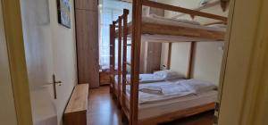 Postel nebo postele na pokoji v ubytování ciao-aschau Haus zur Burg Ap104 Pabst