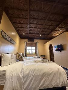 Postel nebo postele na pokoji v ubytování Hotel Riad Xaluca
