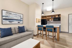 a living room with a couch and a table at Candlewood Suites Boise-Meridian, an IHG Hotel in Meridian