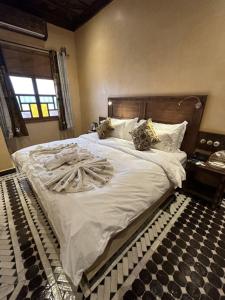 Postel nebo postele na pokoji v ubytování Hotel Riad Xaluca