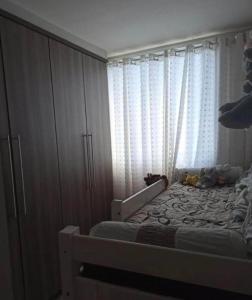 Ένα ή περισσότερα κρεβάτια σε δωμάτιο στο Casa aconchegante boa vista