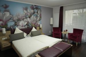 Postel nebo postele na pokoji v ubytování Hotel Dreyer Garni