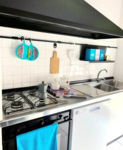 Virtuvė arba virtuvėlė apgyvendinimo įstaigoje Dodo House La Spezia