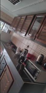 an overhead view of a kitchen with a counter top at Studios-Appartements meublés Makepé BM in Douala
