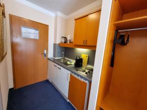 Kuchyň nebo kuchyňský kout v ubytování ciao-aschau Haus zur Burg Apn21 Krämer