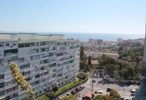 a view of a city with a large building at Coty's Beach in Benalmádena