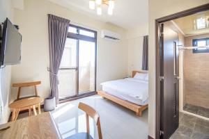 Ένα ή περισσότερα κρεβάτια σε δωμάτιο στο 別野城北